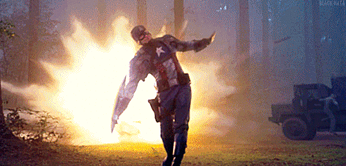 Captain American throwing shield with fire exploding in the background.