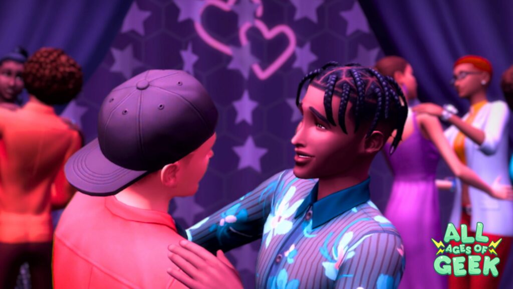 A screenshot from The Sims showing two male Sims dancing closely together at a party. They are smiling at each other with a backdrop featuring stars and heart decorations. Other Sims can be seen dancing in the background. The All Ages of Geek logo is visible in the bottom right corner.