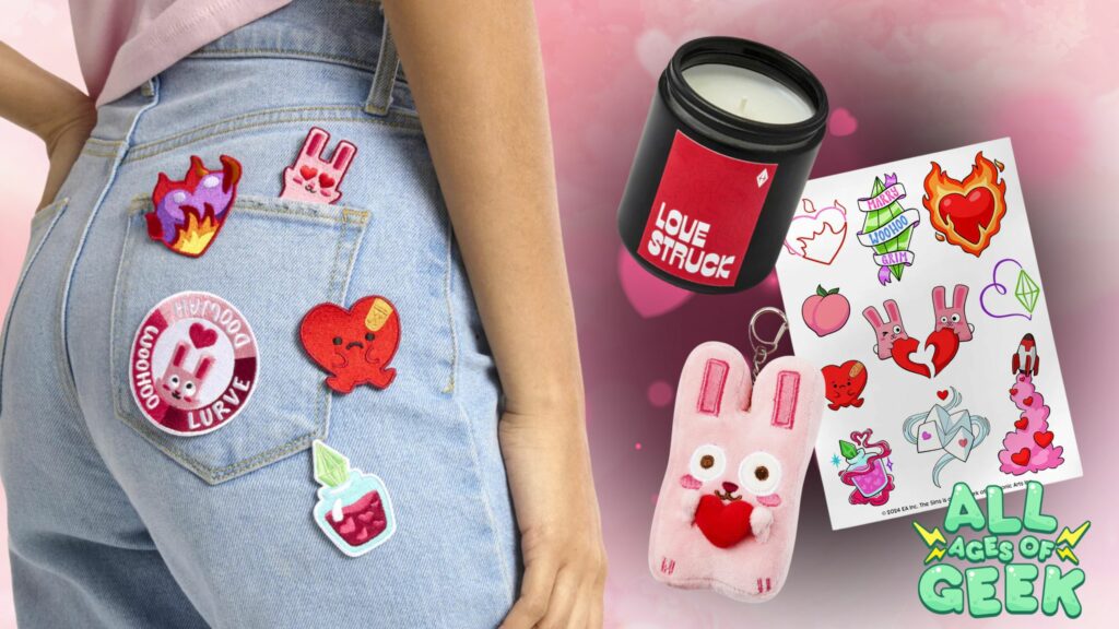 A promotional image for The Sims Shop's limited edition Lurve Collection. The image features various themed items including colorful iron-on patches attached to a pair of light blue jeans, a red "Love Struck" scented candle, a pink Freezer Bunny plush keychain holding a heart, and a sheet of temporary tattoos with playful love-themed designs. The All Ages of Geek logo is displayed in the bottom right corner against a pink and red background with heart motifs.