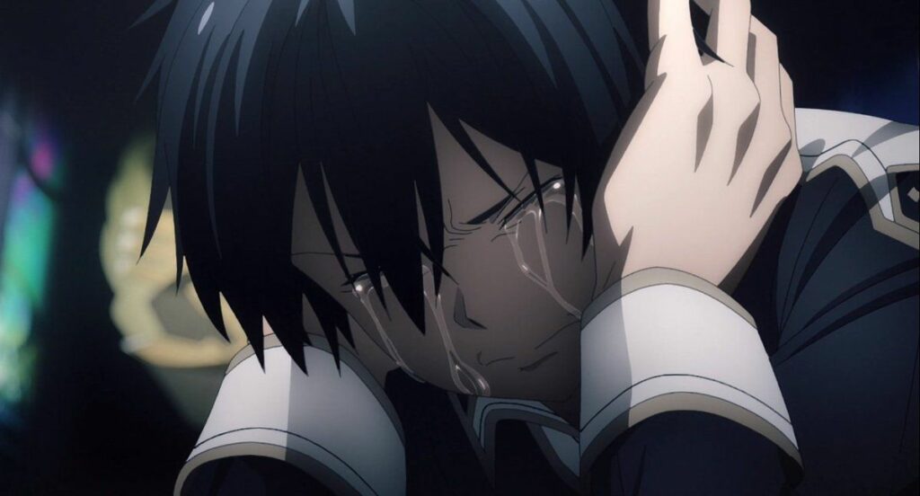 A screenshot from the anime "Sword Art Online" featuring Kirito, the main character, in a deeply emotional moment. He is depicted with tears streaming down his face, his expression conveying intense sadness and pain. The scene is dark, emphasizing the raw emotion as Kirito covers his head with his hand, highlighting a moment of vulnerability. The background is blurred, focusing attention on Kirito's emotional state.