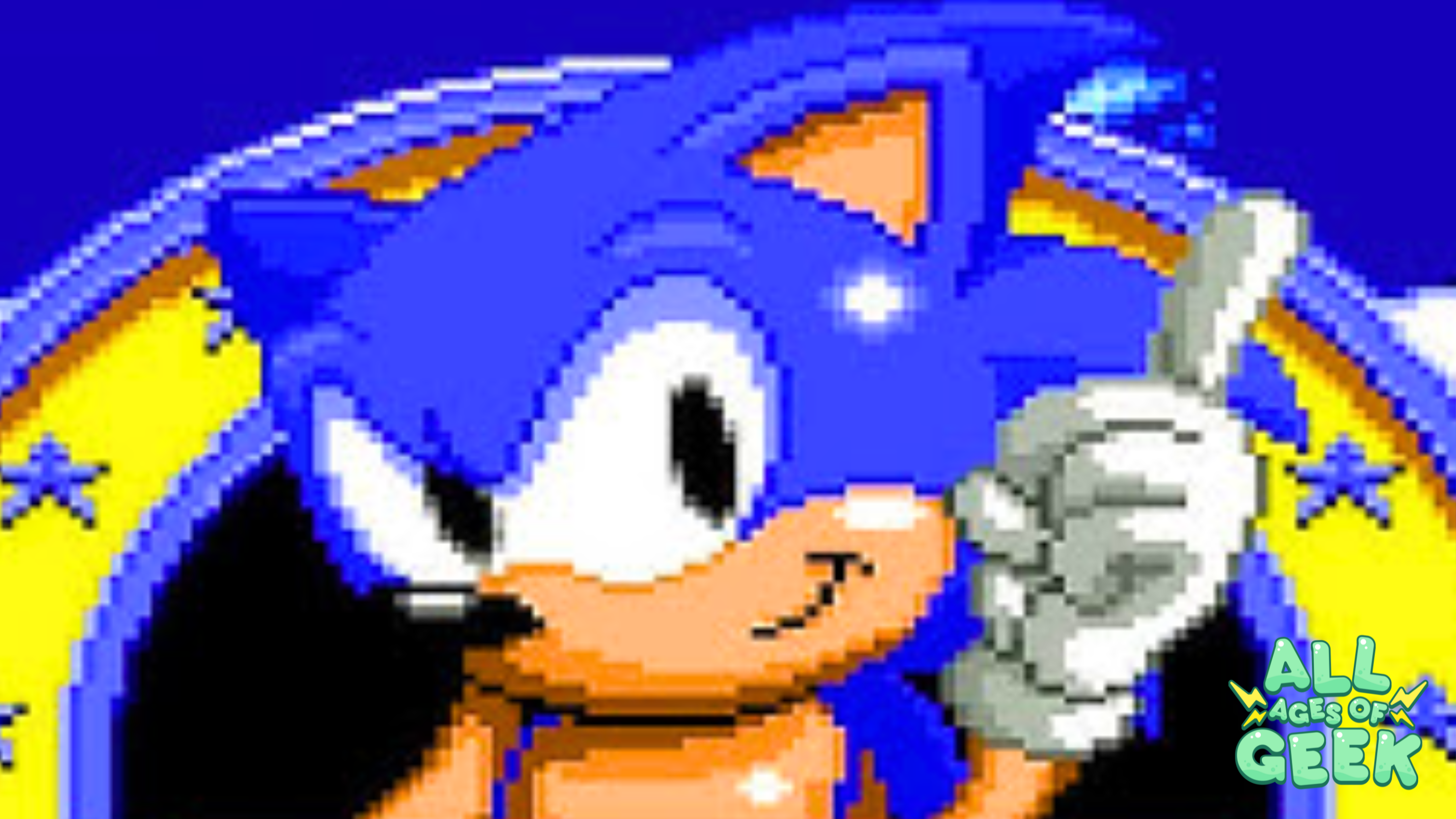 The image shows a pixel art depiction of Sonic the Hedgehog, a well-known video game character. Sonic is giving a thumbs-up with his right hand, while smiling. The background features a large gold ring with blue stars and a blue sky. In the bottom-right corner, the "All Ages of Geek" logo is visible.