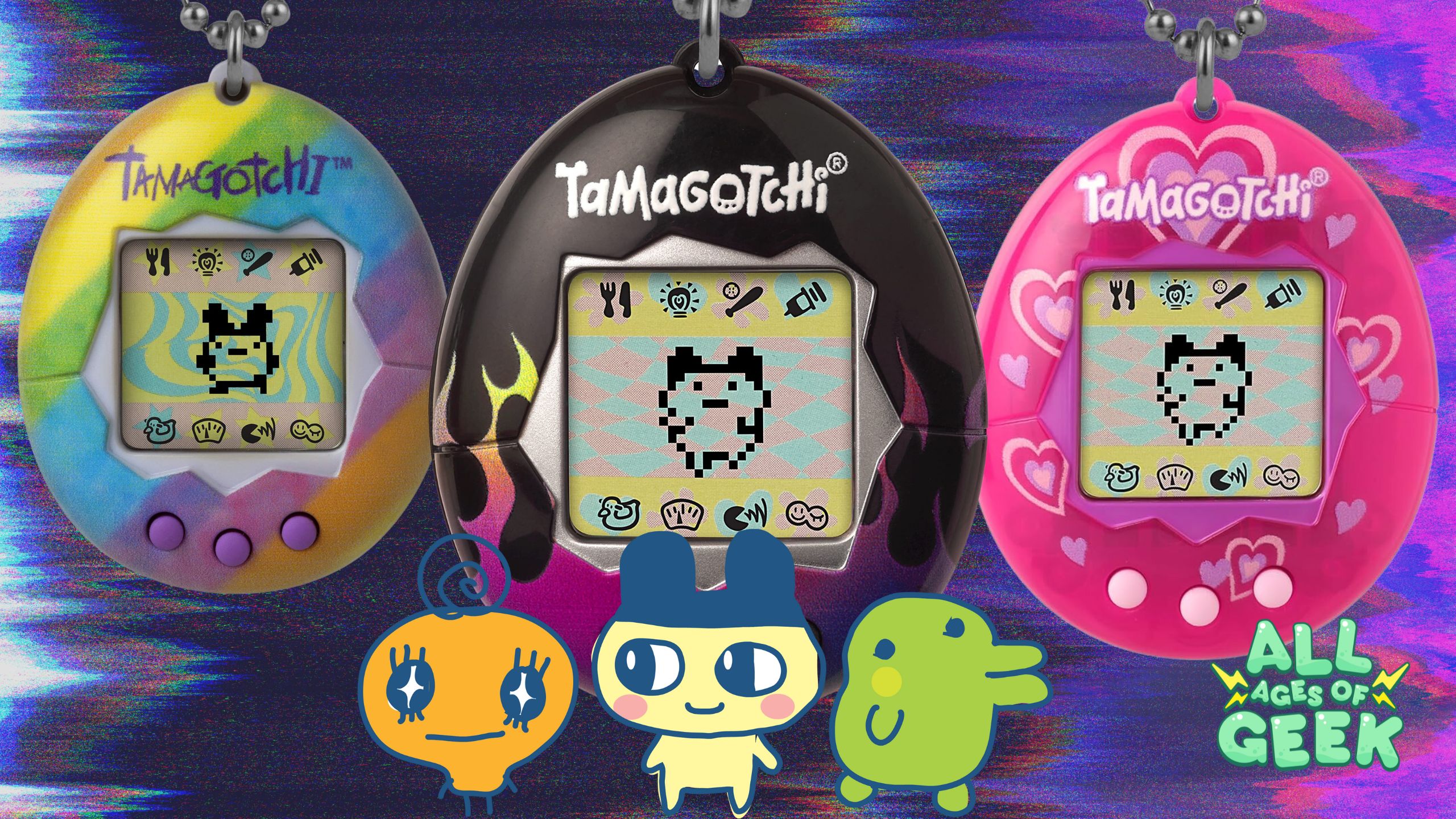 Three colorful Tamagotchi Connection devices are displayed: a tie-dye shell with purple buttons, a black shell with flame designs, and a pink shell with heart patterns. In front of the devices are cartoon characters from the Tamagotchi series. The All Ages of Geek logo is visible in the corner.