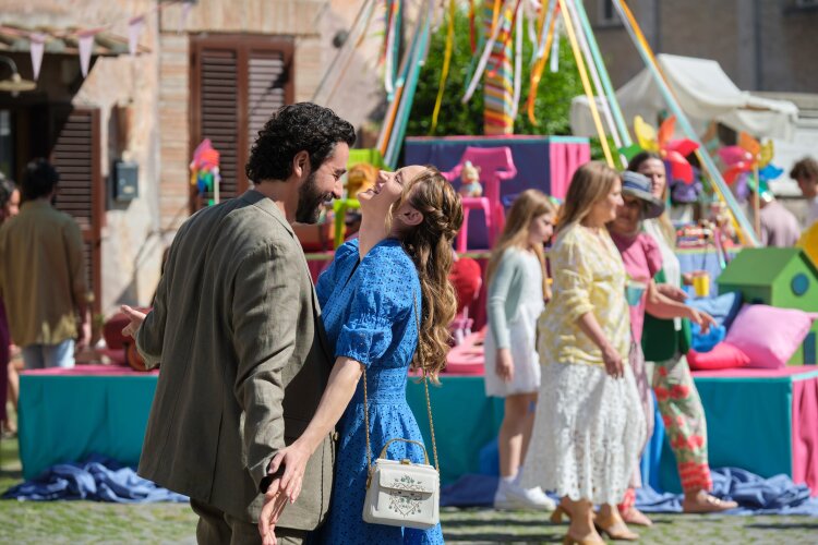 A couple dancing and laughing together at a colorful outdoor festival.  "Two Scoops of Italy"  on Hallmark.