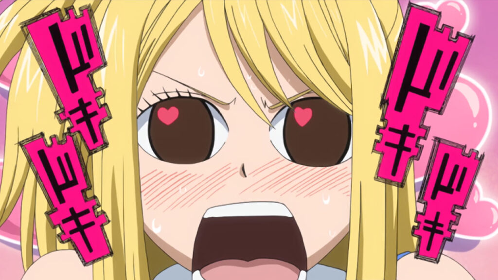 Close up of Lucy from Fairy Tail eyes open, hearts swimming in her brown pupils and mouth agape with blushed cheeks.