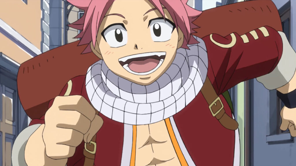 Natsu running through a town, close up, smiling and with a happy, excited expression.