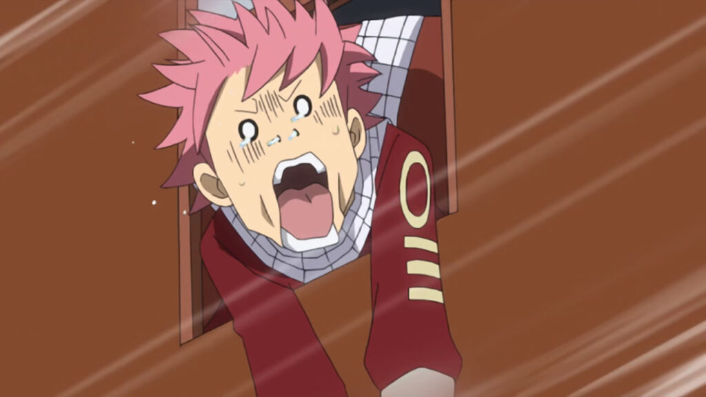 Natsu screaming on a train with white fast lines in front of him, eyes circle and mouth wide open in fear.