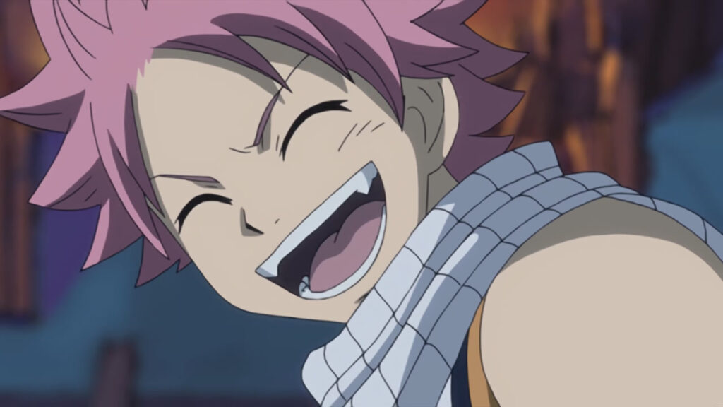 Natsu smirks back at Lucy, blushing with an open mouth and spiked feeth.