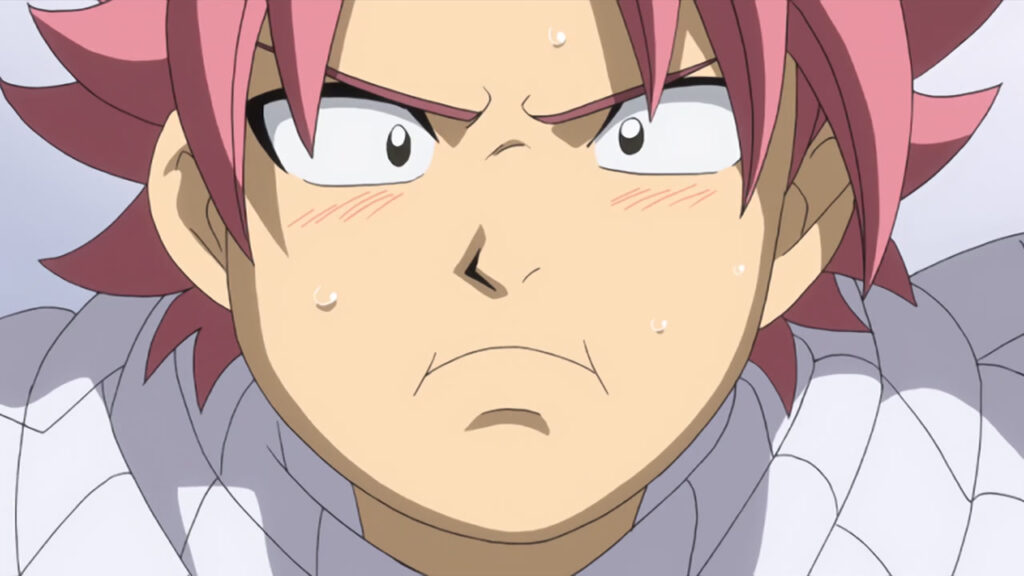 Natsu's face looking a tad sweaty and sick, blush at the sides of his eyes and mouth pursed.