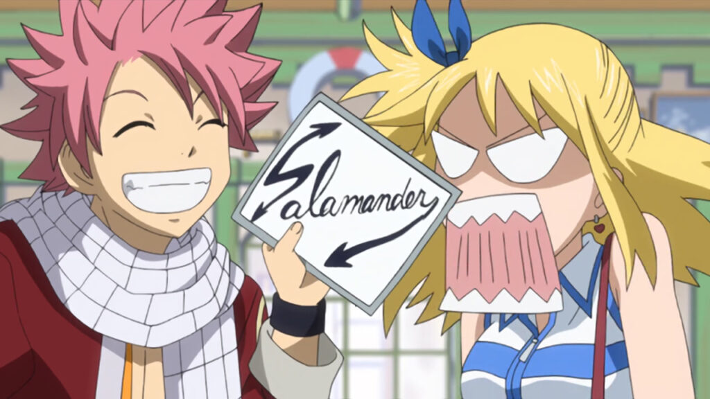 Natsu smirking holding up a napkin that says Salamander in cursive, pointing directly at him as Lucy screams at him in shock.