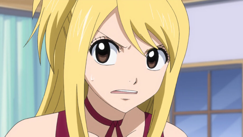 Lucy with a scrunched up concerned face as she waits in a windowed room wearing a tight red dress.