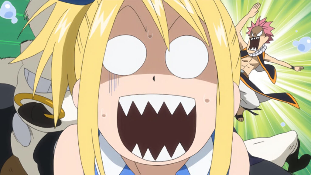 Lucy with shark teeth opens her mouth in shock as Natsu kicks Taurus in the background.