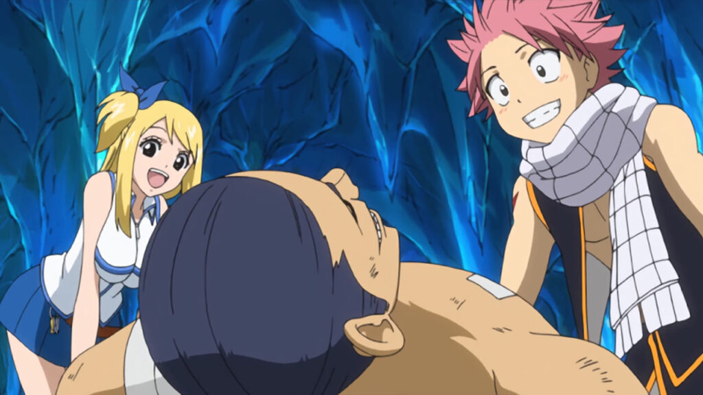 Lucy and Natsu stare down at Macao, smiling and happy that he woke up in the icy cave.