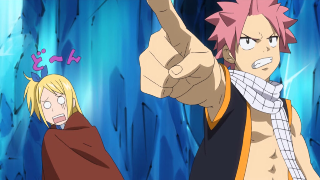 Natsu points at the Vulcan off camera looking determined for a fight as Lucy shivers with the brown blanket in the icy background.