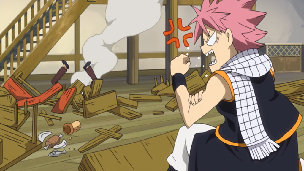 Natsu groaning and growling at wounded Fairy Tail Guild members who were pummeled to the floor on cracked and broken wooden tables.