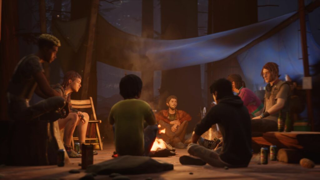 A group of characters surround a small smoking fire as the main characters of Life is Strange 2 are in the foreground, backs in front.