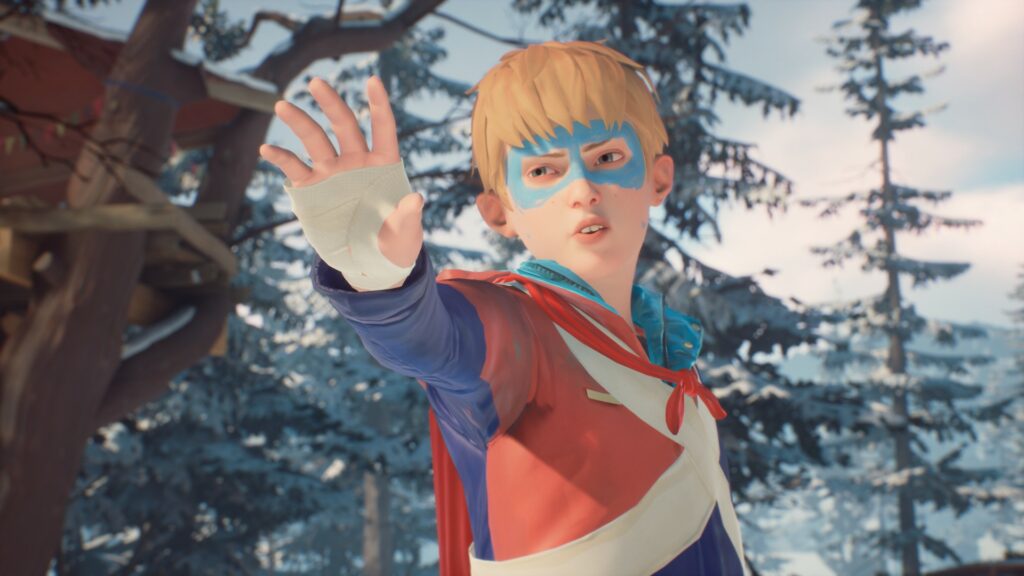 Captain Spirit holds his hand out, dressed in his superhero outfit, with snowfall and snow kissed trees behind him and a wooden tree house.