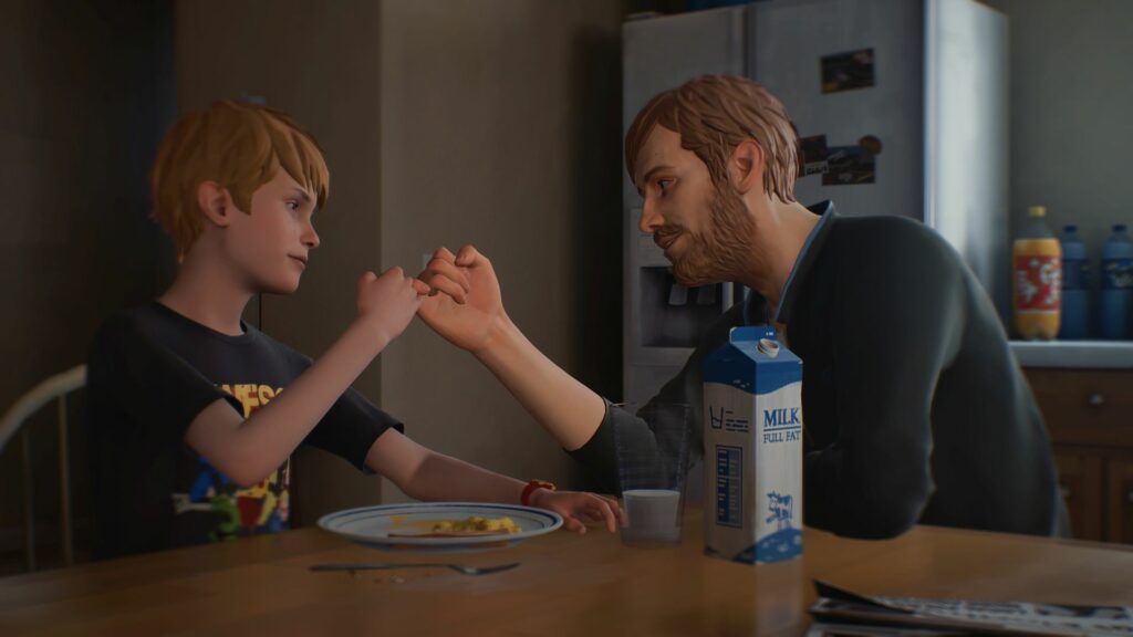 Captain Spirit pinkie promises his dad on a round, kitchen table with milk and plates at the side they look playful and in lost in thought.