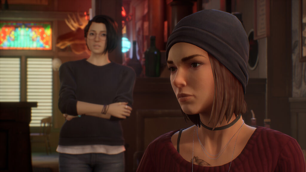 Life is Strange: True Colors characters Steph and Alex staring off camera looking intent in conversation.