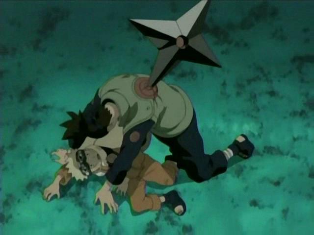 Iruka on top of Naruto, protecting him from a very large ninja star weapon.