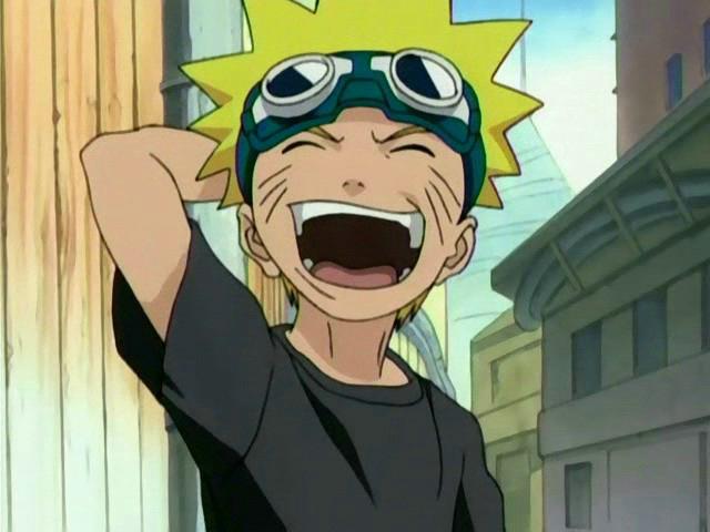 Naruto laughing loudly with his hand behind his head, small buildings behind him and a blue sky.