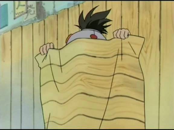 Konohamaru hides behind a fake fence that looks to be a sheet from his ninja hiding skills.
