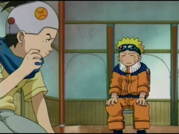 Naruto and Konohamaru sit down and contemplate some ninja ideas together in a simple looking classroom.