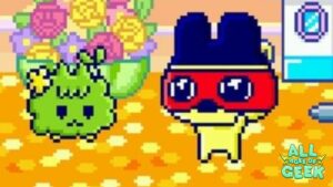 "Mametchi from Tamagotchi Uni wearing a red superhero mask, standing next to a green Tamagotchi character with a flower in its hair. The scene is vibrant and colorful, with a background of flowers and the All Ages of Geek logo at the bottom right."