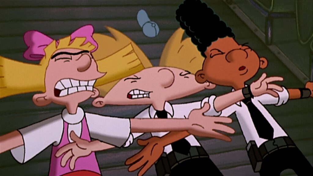 An animated scene from 'Hey Arnold!' featuring three characters—Helga, Arnold, and Gerald—standing side by side with their arms extended outward. Helga, on the left, wears a pink dress and a large pink bow, with a determined expression and gritted teeth. Arnold, in the middle, wears his signature blue cap and white shirt with a black tie, also with a determined expression. Gerald, on the right, has his distinctive tall, flat-top hairstyle and is dressed similarly in a white shirt and black tie. The background appears to be an interior setting with wooden walls and a staircase.