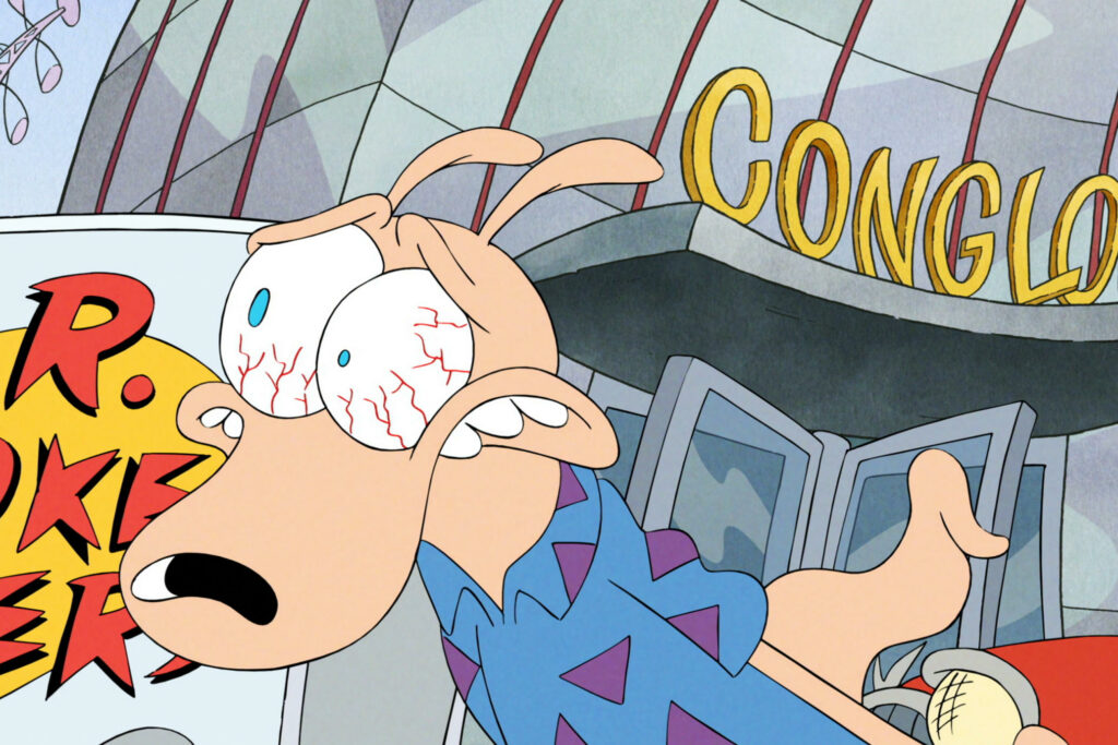 An animated scene featuring Rocko from 'Rocko's Modern Life.' Rocko, a wallaby, has a shocked and stressed expression with bloodshot eyes. He is wearing his signature blue shirt with purple triangles. Behind him is the Conglom-O Corporation building with its name visible in large yellow letters. Part of a 'R. SOKER' sign is also visible to the left of Rocko.