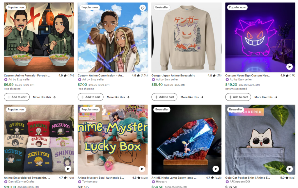 The image shows a selection of anime-themed products available on Etsy. The products include: A "Custom Anime Portrait" featuring a couple eating ramen, labeled as "Popular now" and priced at $6.99 (30% off). A "Custom Anime Commission" of a couple, also labeled as "Popular now" and priced at $7.00 (30% off). A "Gengar Japan Anime Sweatshirt," marked as a "Bestseller," priced at $15.40 (45% off). A "Custom Neon Sign" featuring a Gengar design, labeled "Popular now," priced at $49.20 (40% off). Several "Anime Embroidered Sweatshirts" with characters from "Demon Slayer," labeled "Popular now" and priced at $20.00 (60% off). An "Anime Mystery Box" with various anime merchandise, labeled "Popular now," priced at $31.95. An "Anime Night Lamp Epoxy Lamp" featuring an action scene, labeled as a "Bestseller," priced at $54.50 (60% off). A "Gojo Cat Pocket Shirt" with an embroidered cat design, marked as a "Bestseller," priced at $36.50. The page showcases a variety of anime-related items, emphasizing popular and bestselling products, along with discounts and free shipping offers.