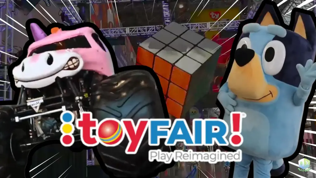A colorful photo from Toy Fair NY 2025 featuring a large Rubik’s Cube display, a pink unicorn-themed monster truck, and a Bluey mascot standing under bright convention lights, with the Toy Fair “Play Reimagined” logo and the All Ages of Geek watermark.