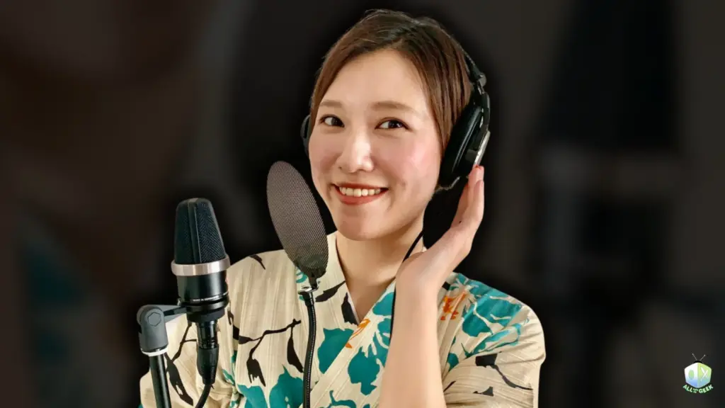 Japanese voice actress Yuui Hiromatsu smiles in front of a studio microphone, wearing headphones and a floral yukata during her interview with All Ages of Geek.