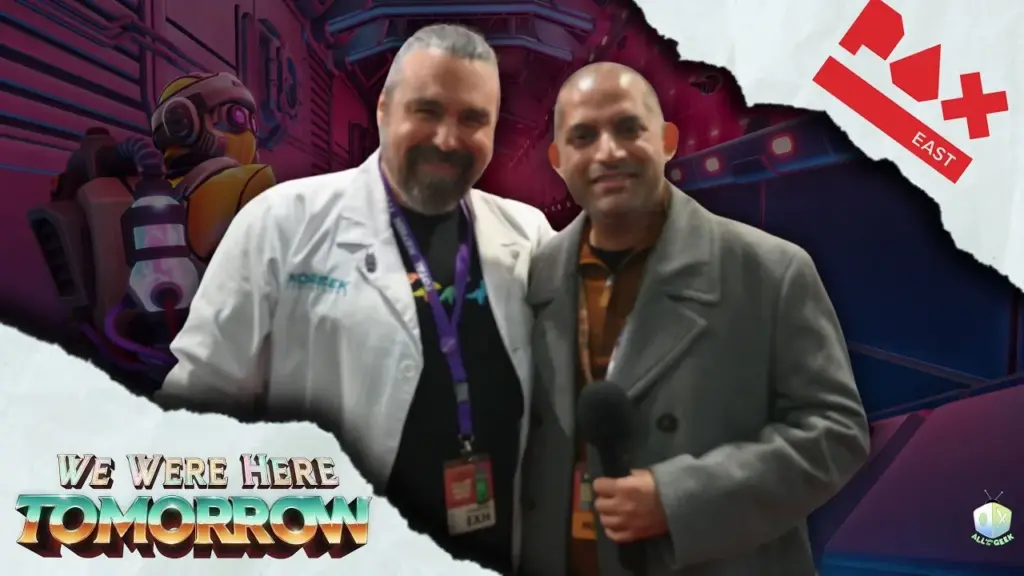 Two men stand together at PAX East 2026, one holding a microphone, with We Were Here Tomorrow artwork in the background during an interview.