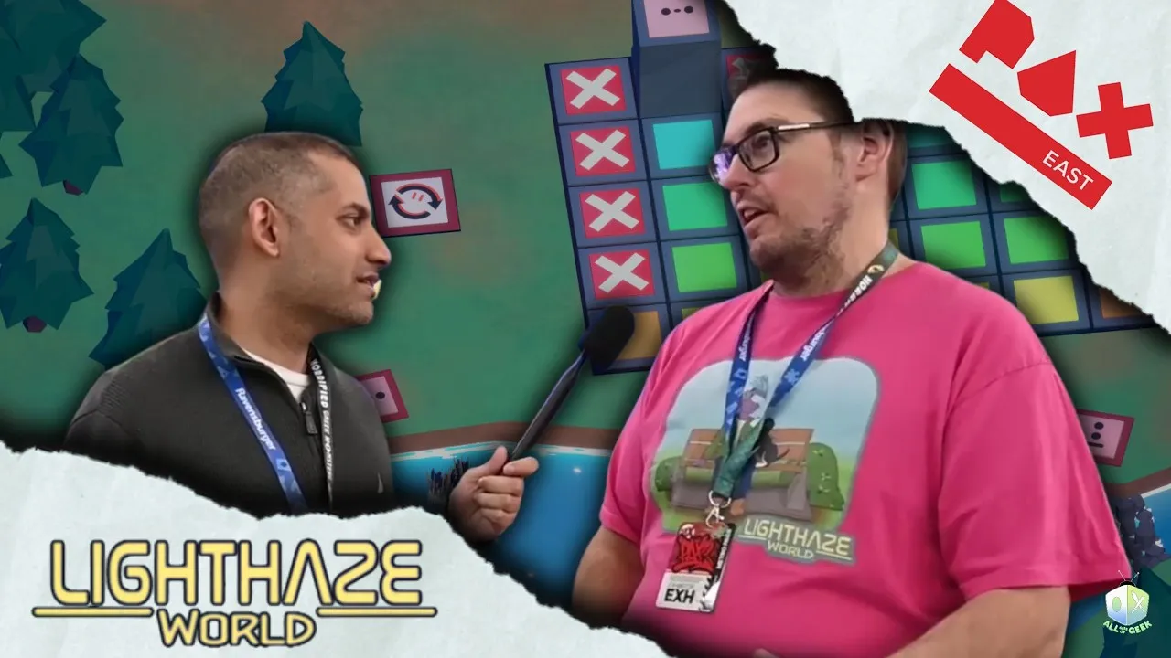 Two men speak during a PAX East interview in front of Lighthaze World gameplay visuals, with one holding a microphone and the game logo visible on screen.